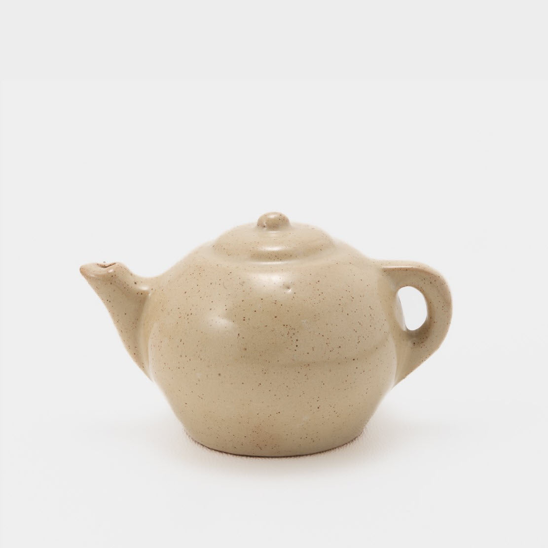 Frankoma <br> Miniature Teapot <br> c. 1936-1938, H. 2" <br> Ivory Glaze <br> Ada Clay, Round O