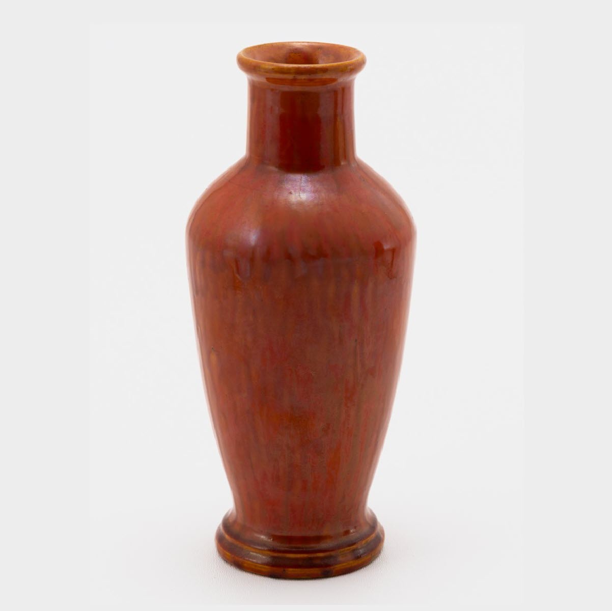 John Frank <br> OU Tepee Vase <br> 1928, H. 8" <br> Reddish Orange <br> Ada Clay, JNF '28