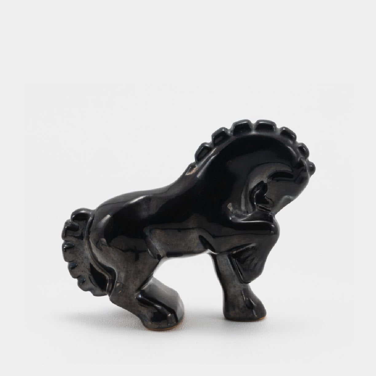 Frankoma <br> #138 Circus Horse <br> c. 1936-1938, H. 4 1/2" <br> Onyx Black <br> Ada Clay, Round O