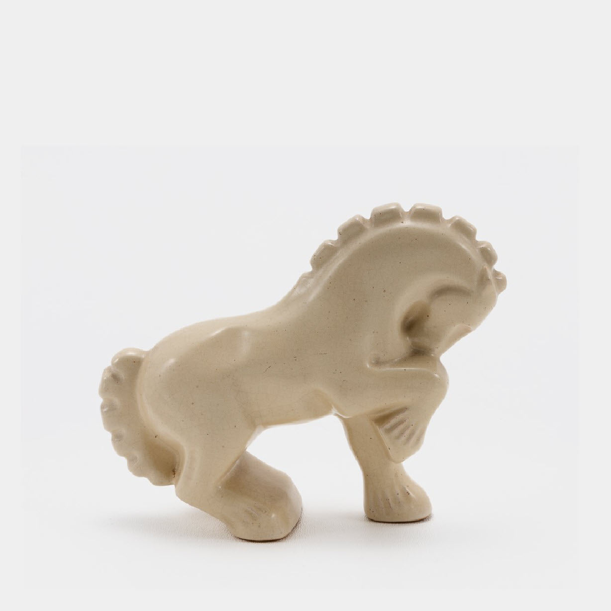 Frankoma <br> #138 Circus Horse <br> c. 1936-1938, H. 4 1/2" <br> Ivory Glaze <br> Ada Clay, Round O