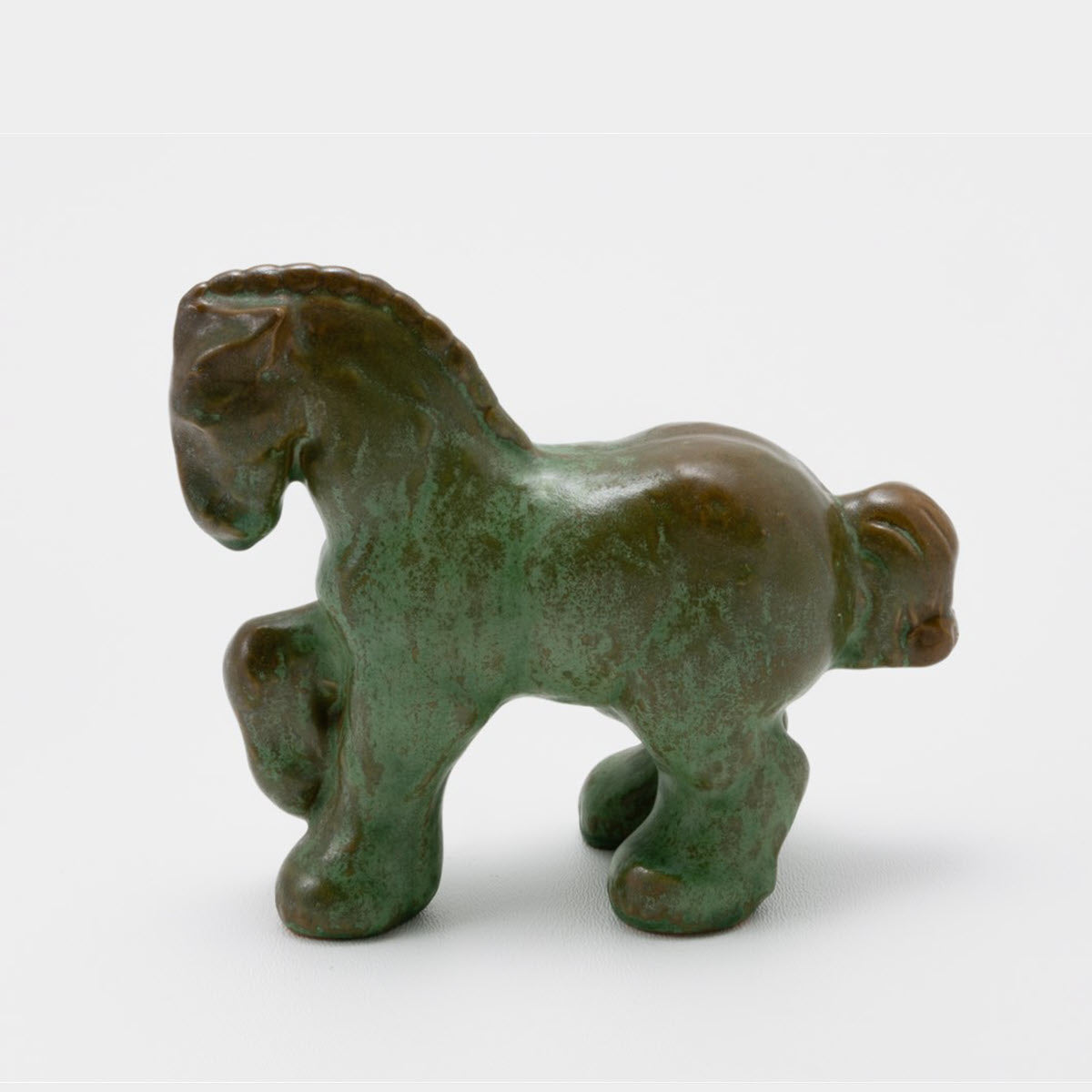 Frank Potteries <br> #108 Prancing Percheron <br> c. 1933-1934, H. 3 3/4" <br> Prairie Green <br> Ada Clay, Ink Stamp