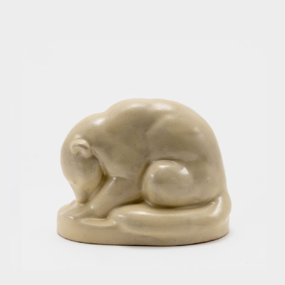 Frank Potteries <br> #137 Coati Mundi <br> c. 1933-1934, H. 4 3/4" <br> Ivory Glaze <br> Ada Clay, Ink Stamp