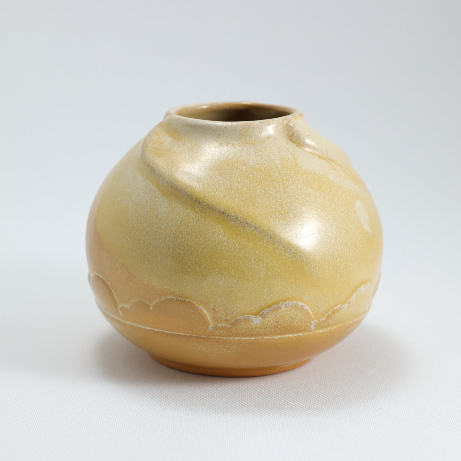 Frank Potteries <br> #70 Carved Jar <br> c. 1933-1934, H. 5 1/4" <br> Old Gold <br> Ada Clay, Ink Stamp