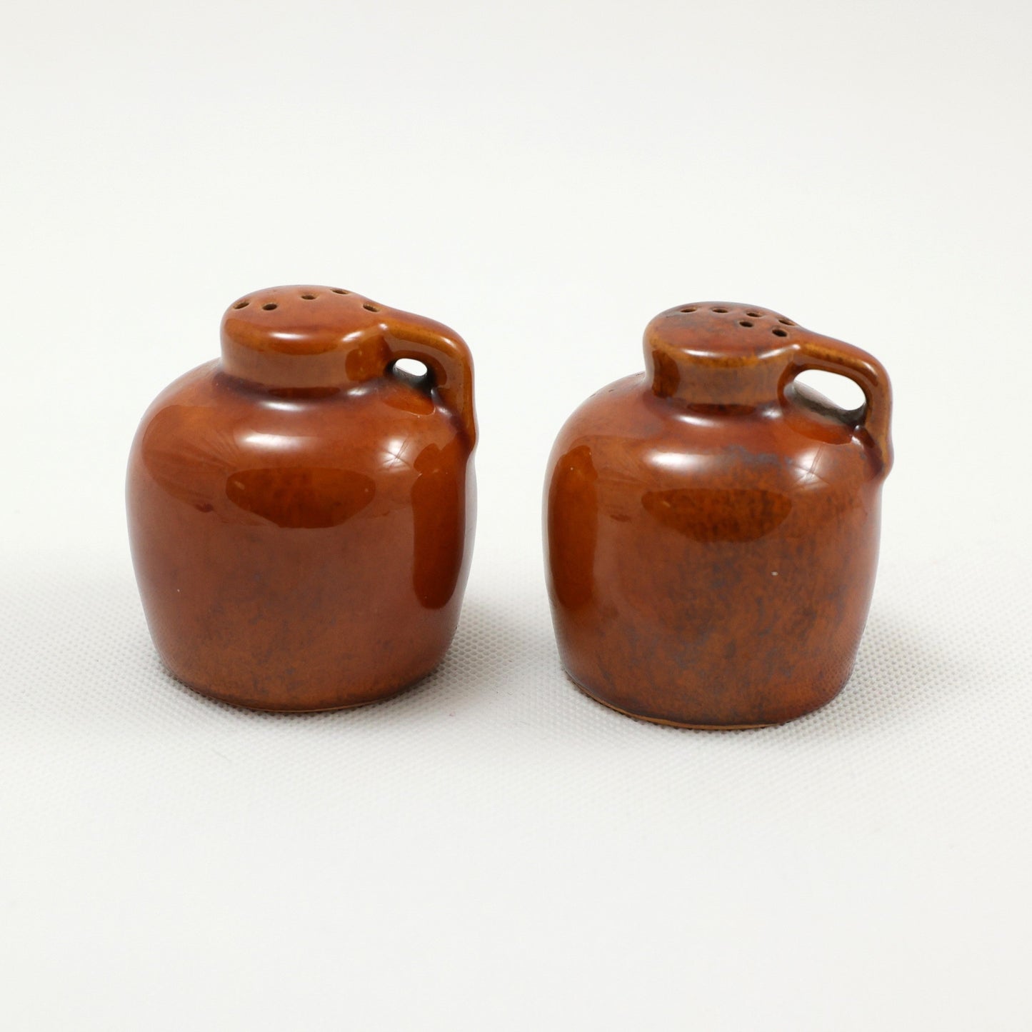 Frankoma <br> #10H Jug Shakers <br> c. 1942, H. 2 1/4" <br> Osage Brown <br> Ada Clay, Unmarked <br> <br> Free Shipping